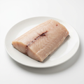 Svärdfiskfilé Xiphias gladius på vit tallrik