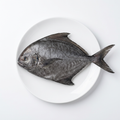 Black Pomfret Ca Chim Den på vit tallrik, illustrativ produktbild.